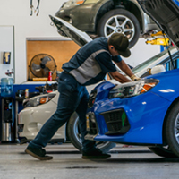 M45 technician working on a Subaru in the shop